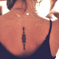 a woman with a tattoo on her back