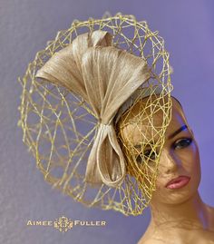 Structured, chic crisscross woven material on this asymmetrical showpiece. Fancy gold-threaded sash.    Easy-to-wear headband fascinator makes a statement, and can be worn to a myriad of events: Easter, Bridal, Derby-Wear, Del Mar Races, Hat Contests, Church, Gala, Kentucky Derby, Melbourne Cup, High Tea, Weddings, Cocktail Parties, and more.  Some customizing available; please message with your requests to see if we can meet your needs. Other colors available; please inquire before purchase if you need another.  We look forward to working with you! *FREE SHIPPING  For more STATEMENT JEWELRY and HANDMADE HATS go to www.aimeesfuller.com Aimee Fuller has been a trusted online seller since 1999, and is excited to bring her creations back to Etsy.  Though often copied by hobbyists and even hig Chic Structured Crown Fascinator For Church, Fitted Fascinator With Structured Crown For Events, Chic Fitted Fascinator For Church, Gold Curved Brim Fascinator For Spring, Fitted Beige Mini Hat For Event, Fitted Beige Mini Hat For Events, Luxury Evening Fascinator For Royal Ascot, Chic Fitted Fascinator With Structured Crown, Gold Spring Fascinator For Church