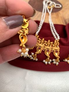 Goddess Lakshmi Red Stone Pendent Set With Pearl Mala with matching earringsColor : GoldenSize : Mala Length : Approx 18 Inches; Earring Length : Approx 1.5 Inches;Stones : Red Stone Pearls Pearl Mala, Pendent Set, Goddess Lakshmi, Red Stone, Social Events, Indian Jewelry, Stone, Red