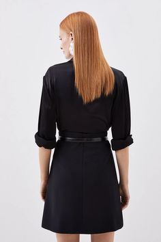 A mini skirt is elevated with this piece, expertly tailored with a high waist, while a front circular cut out detail features pleats for textural enlivenment. Pair with a knitted top and knee high boots for a playful yet sophisticated ensemble.Mini lengthHigh waistCut out detailPleated Belted Black Mini Skirt For Workwear, Fall Workwear Knee-length Skort, Modern Fitted Mini Skirt For Fall, Belted Fitted Skort For Workwear, Fitted Belted Mini Skort, Belted Fitted Mini Skirt Skort, Fitted Mini Skort With Belt, Elegant Belted Short Skort, Formal Knee-length Mini Skirt For Fall