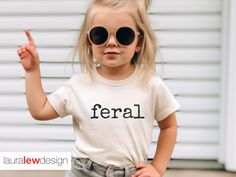 And Youth Sizes: https://www.etsy.com/listing/1526714505/feral-youth-shirt-funny-shirt-for-boy Also available in Adult Sizes: https://www.etsy.com/listing/1512501628/feral-shirt-funny-gift-for-her-funny Uplift any child's wardrobe with a custom kid's t-shirt. The Bella Canvas short sleeve tee for toddlers is a 100% Airlume combed and ring-spun cotton jersey with a tear-away label for extra comfort. Choose your favorite color out of a big variety, and make unique staples that toddlers will happily wear every day.  * 100% Airlume combed and ringspun cotton (fiber content may vary for different colors) * Extra light fabric (3.9 oz/yd² (132 g/m * Tear-away label Toddler T Shirt Ideas, Kids Vinyl Shirt Ideas, Toddler Tshirt Ideas, Funny Shirt Ideas, Untamed Funny, Funny Toddler Shirt, Funny Kids Shirts, Wild Baby, Hippie Shirt