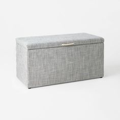 a grey and white striped storage box