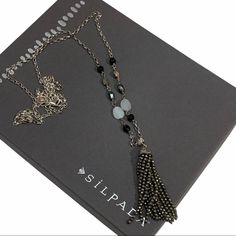 Silpada Sterling Silver 'Paint it Black' N3091 New! Never Worn! This Silpada necklace is a must-have for any jewelry collection.  Designed with luxurious 925 sterling silver, agate, hematite, pyrite, and a elegant tassel, this necklace will make you stand out from the crowd.  Its 36" long length adds style and sophistication, creating an eye-catching look perfect for a sophisticated evening outfit.  Its unique combination of natural and precious materials makes this necklace an alluring accessor Silver Lariat Long Necklace As Gift, Silver Lariat Long Necklace For Gift, Bohemian Silver Tassel Necklace Gift, Silver Bohemian Tassel Necklace As Gift, Silver Long Necklace With Adjustable Chain As Gift, Silver Dangle Long Necklace As Gift, Silver Adjustable Long Tassel Necklace, Tassel Necklace As Gift, Adjustable Silver Long Tassel Necklace