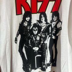 Band: kiss Size:  20" pit to pit  &      26" collar to bottom  Colors: white Condition: good, stain on back shown in picture  **all of our shirts are PRE-OWNED and may contain normal wear, fading, stains or imperfections, holes, tears, loose or missing threads. We will do our best to point out significant issues. Thank you for looking!! #tshirt #fashion #streetwear #tshirts #graphic