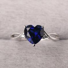 ◆ The ring is handcrafted from sterling silver and decorated with a dazzling 8*8 mm sapphire and CZs. It is suitable for engagement/anniversary/daily occasion. ◆ Production Description: Main stone Type: Lab Sapphire Main Stone Shape: Heart Cut Main Stone Size: 8*8 mm(2.6ct) Side stone: CZ Metal: 925 Sterling silver - Other options available in the drop down menu ◆ Customization: √Free for Add Engraving √Other Metal Type Available √Other Gemstones & Shapes Available √Personalization Requests Avai Sterling Silver Blue Sapphire Rings, Heart Shaped Sapphire Ring, Heart-shaped Sapphire Jewelry For Anniversary, Heart Cut Sapphire Ring With Diamond, Elegant Sapphire Ring With Heart Cut And Accent Stones, Elegant Heart Cut Sapphire Ring For Anniversary, Elegant Heart Cut Sapphire Ring With Accent Stones, Elegant Heart Shaped Sapphire Ring For Formal Occasions, Heart-shaped Sapphire Ring, Fine Jewelry