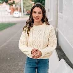 The Women's Beige Cable Knit Drop Shoulder Sweater is the cozy hug you never have to ask for. Perfectly oversized for lounging, it offers a relaxed fit that makes it ideal for chilly mornings and cozy evenings at home. The beautiful cable knit pattern adds a touch of texture and warmth, making it both stylish and functional. Whether you're snuggling up with a book or heading out for a casual coffee date, this sweater is versatile enough to transition seamlessly between lounging and outings. Pair Cable Knit Crew Neck Sweater For Loungewear, Cream Cable Knit Cropped Sweater With Crew Neck, Cozy Cable Knit Cropped Sweater With Crew Neck, Cozy Beige Cropped Sweater With Textured Knit, Cozy Beige Cropped Sweater For Winter, Cozy Beige Textured Knit Cropped Sweater, Snug Beige Casual Sweater, Casual Snug Beige Sweater, Snug Fit Casual Beige Sweater