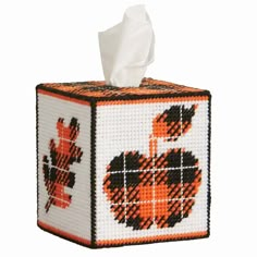 a tissue box with an orange heart on it