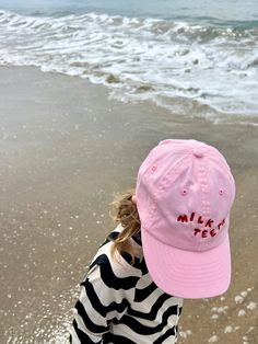 A kid-sized baseball cap with Milk Teeth logo embroidery. In soft cotton canvas, these hats have all the details of an adult baseball cap, scaled down to fit toddlers and kids. Adjustable brass fastening in back. One size fits approx. 3-9 years. Adult version also available :) Playful Adjustable Cotton Baseball Cap, Pink Cotton Baseball Cap With Letter Print, Playful Cotton Baseball Cap For Spring, Playful Pink Cotton Baseball Cap, Pink Snapback Baseball Cap In Cotton, Pink Cotton Snapback Baseball Cap, Pink Cotton Snapback Hat With Curved Brim, Playful Cotton Baseball Cap, Pink Curved Brim Cotton Snapback Hat