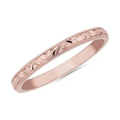 Delicate milgrain detail and graceful swirling design gives this elegant stackable band a vintage-inspired look. It features gleaming 14k rose gold design that promises lasting quality and beauty. Elegant Engraved Ring With Decorative Round Band, Elegant Stackable Engraved Ring, Elegant Engraved Ring With Decorative Band, Rose Gold Rings With Decorative Band, Elegant Bands With Intricate Design, Heirloom Stackable Engraved Rose Gold Ring, Elegant Stackable Rings With Engraving Option, Heirloom Rose Gold Engraved Stackable Ring, Elegant Engraved Stackable Rings