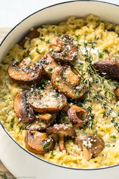 a white bowl filled with mushrooms and rice