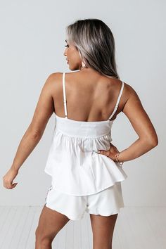 Our adorable white 'Lovely Story' tank is the upgrade your wardrobe has been asking for with its lightweight material, square neckline with adjustable spaghetti straps, and flattering figure hugging bodice that falls into a flirty babydoll silhouette with a straight hemline! Distressed Pants, Babydoll Tank, Impressions Online Boutique, Model Fits, Bad Girl, Hip Length, Square Neckline, High Waisted Shorts, Online Womens Clothing