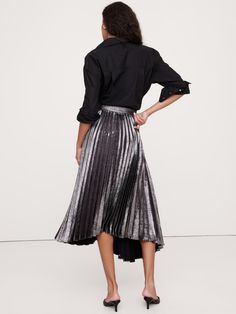 Our iteration of the season's pleated midi skirt relies on a twill fabric we love for its soft structure, which give it the ability to hold crisp pleats that layer in asymmetric panels for an architectural effect.  High waisted.  A-line.  Zip closure at side.  Unlined.  High waisted.  A-line.  Midi length.  Model: Size 2, 5'10" (178cm). Asymmetrical Midi Skirt, Party Sale, Pleated Midi Skirt, Twill Fabric, Winter Sale, Midi Length, Apparel Accessories, Banana Republic, Midi Skirt