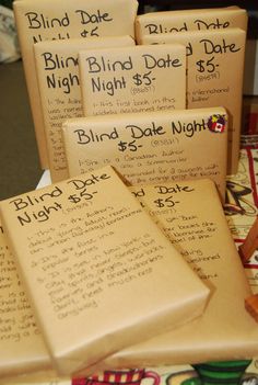 several packages of blindfolded books on a table with price tags attached to them