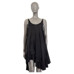 100% authentic Stella McCartney sleeveless mini dress in black rayon (79%) and silk (21%). Features an asymmetrical silhouette, loose fit and accordion pleated hem. Unlined. Shows some faint stains overall in excellent condition. Measurements Tag Size 38 Size XS Bust 100cm (39in) to 134cm (52.3in) Waist 122cm (47.6in) to 160cm (62.4in) Hips 160cm (62.4in) to 220cm (85.8in) Length 67cm (26.1in) All our listings include only the listed item unless otherwise specified in the description above. Chic Sleeveless Silk Asymmetrical Dress, Chic Silk Asymmetrical Sleeveless Dress, Sleeveless Silk Mini Dress For Daywear, Black Silk Sleeveless Summer Dress, Silk Sleeveless Mini Dress For Daywear, Chic Silk Mini Dress With Asymmetrical Hem, Black Sleeveless Silk Dress For Summer, Black Sleeveless Viscose Slip Dress, Asymmetrical Silk Mini Dress