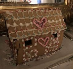 a gingerbread house decorated with icing and candy