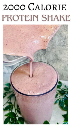 a smoothie is being poured into a glass with the words 200 calorie protein shake