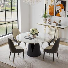 a dining room table with chairs around it