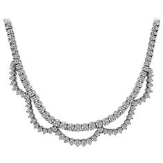 This is a stunning 18k white gold necklace. The necklace is set with sparkling round cut diamonds that weigh approximately 15.00ct. The color of these diamonds is H with VS2-SI1 clarity. The necklace measures 16 inches in length and weighs 54.5 grams. Inventory #17218EABS Delicate Diamond Necklace, Antique Necklaces, White Gold Necklace, Vintage Necklaces, White Gold Necklaces, Antique Necklace, Antique Diamond, Lovely Jewellery, Vintage Designer