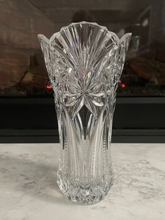 a glass vase sitting on top of a counter