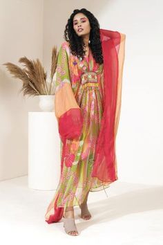 Orange, pink kaftan with floral printed motifs and embroidery on the waist.
Component: 1
Pattern: Print and Embroidery
Type Of Work: Floral Print and Thread
Neckline: V neck
Sleeve Type: Flared
Fabric: Georgette
Color: Orange,Pink
Other Details: 
Bead tassel detail at the waist
Lace trim on the hems
Occasion: Resort - Aza Fashions Pink Kaftan, Kaftan For Women, Print And Embroidery, Orange Floral Print, Embroidery Floral, Fashion App, Beaded Tassels, Floral Printed, Orange Pink