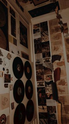 there are many records on the wall in this room