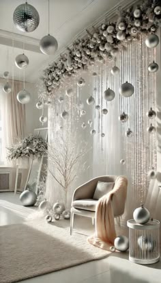 a room with ornaments hanging from the ceiling, and a chair in front of it