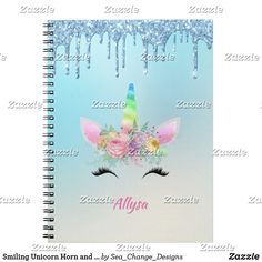 a spiral notebook with an unicorn's face and flowers