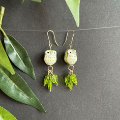 These bright green owls in their bed of green leaves will be a fun addition for any outfit. Playful Green Earrings For Summer, Playful Green Summer Jewelry, Summer Green Playful Jewelry, Green Handmade Fun Earrings, Green Dangle Jewelry For Spring, Cute Adjustable Green Earrings, Trendy Green Leaf-shaped Jewelry, Handmade Green Fun Jewelry, Handmade Fun Green Jewelry