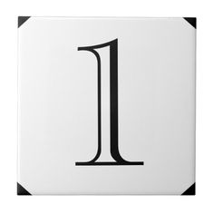 a black and white tile with the letter i on it's side, in front of a white background