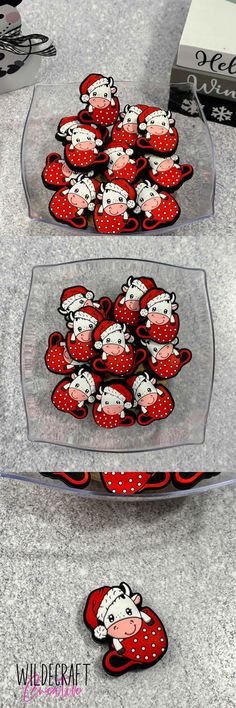 two glass trays filled with red and white strawberries on top of a counter