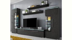 a modern living room with grey walls and white furniture, including a flat screen tv