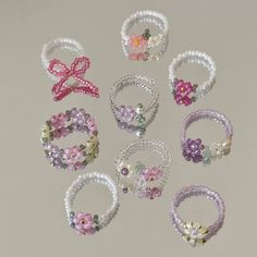 several different types of bracelets with bows on them