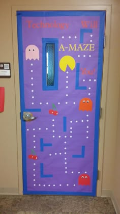 a door decorated with an image of pacman