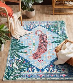 a blue rug with a tiger on it in the middle of a living room area