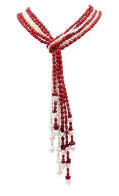 a red and white beaded necklace with beads