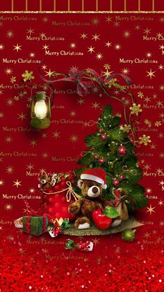 a teddy bear sitting next to a christmas tree on a red background with snowflakes