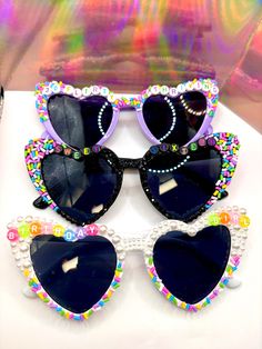 BEDAZZLED Heart Sunglasses 3D Multi-Colored Heart Beads TOTALLY CUSTOMIZABLE Please include color of glasses, letters, phrase, and date needed by. Cheer Squad Gifts Heart Glasses, Multicolor Plastic Sunglasses For Birthday, Bedazzled Sunglasses Diy, Playful Multicolor Party Sunglasses, Decorate Sunglasses, Birthday Glasses, Funky Glasses, Resin Jewelry Making, Pinterest Ideas