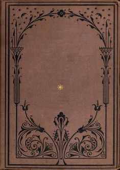 an old book with black and gold designs on the front cover, featuring a golden star