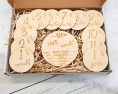 a box filled with wooden tags and numbers