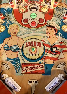 an old fashioned pinball machine with two women on it's front and side