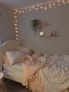 a bedroom with lights strung above the bed