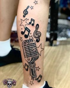 a person with a microphone and musical notes on their leg