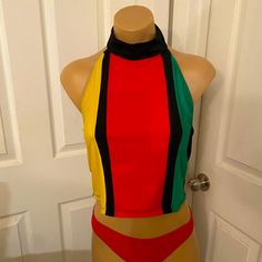 Reggae Womens Alterback Blouse Spandex/Lycra High Neck, 2 Button Closure, Elastic Secure Color:- Black, Red, Green, Yellow Handmade In Jamaica By Charmaine’s Creation Size:- Fits Up To A Medium Check Measurements Below Length ~ 16ins Armpit To Armpit ~ 15 Ins Fitted Multicolor Halter Top, Casual Fitted Multicolor Halter Top, Fitted Sleeveless Color Block Top, Fitted Color Block Beach Tops, Fitted Color Block Tops For Beach, Fitted Retro Multicolor Tops, Casual Multicolor Stretch Halter Top, Fitted Multicolor Beach Tops, Pink Velvet Top