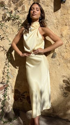 DETAILSOur Esther Maxi Dress is the epitome of high class. This elegant high neck drape detailing makes this maxi the perfect choice for elegant wedding festivities. Add a nude bag and heels for that simple finishing touch. - Maxi length- High neckline- Asymmetrical shoulder design- Invisible zipper and button closures on back- Elasticated waist- 100% PolyesterSeen styled here on the gorgeous mumma to be @valaree.ahern wearing a size 18MODELMEASUREMENTSFor additional information regarding product sizing. please contact our customer service team at customerservice@billyj.com.au x Approx garment measurements are in cms Please allow 1-2cm tolerance SIZE BUST WAIST HIPS LENGTH 6/XS 88 66 98 131 8/S 92 68 102 132 10/M 96 72 110 133 12/L 98 76 116 134 14/XL 102 80 120 135 16/XXL 106 84 126 136 1 Bride Party Dress, Silk Yellow Dress, Nude Bags, Wedding Festivities, Yellow Silk, Mini Dress Formal, Shoulder Design, High Class, Wedding Attire