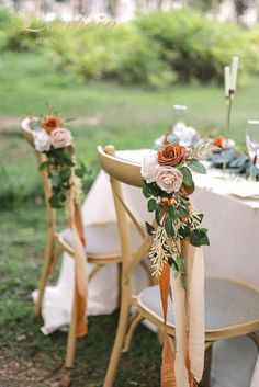 the chairs are decorated with flowers and ribbons