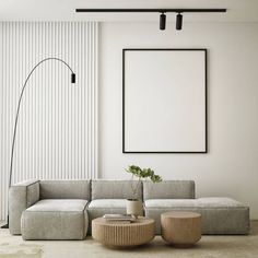 a living room with a couch, chair and table in it next to a large poster on the wall