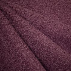 a close up image of a purple towel