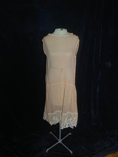 "1920's sheer peach sleeveless flapper dress with a rhinestone neckline and a white lace hem. HAS ISSUES - has several stains throughout including underarm stains. See all photos before purchasing. Wearable if you're delicate Womens small 40\" bust 38\" waist 60\" hips 21\" shoulder to waist 21\" waist to hem" Underarm Stains, Rhinestone Collar, Sweater Pin, Hanging Photos, Lace Hem, Dress Clothes For Women, White Lace, Flapper Dress, Dress Outfits