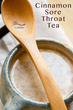 cinnamon sore throat tea in a mug with a wooden spoon on the side and text overlay that reads, cinnamon sore throat tea