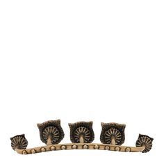 three owl figurines sitting on top of a wooden stand with four owls perched on it's sides